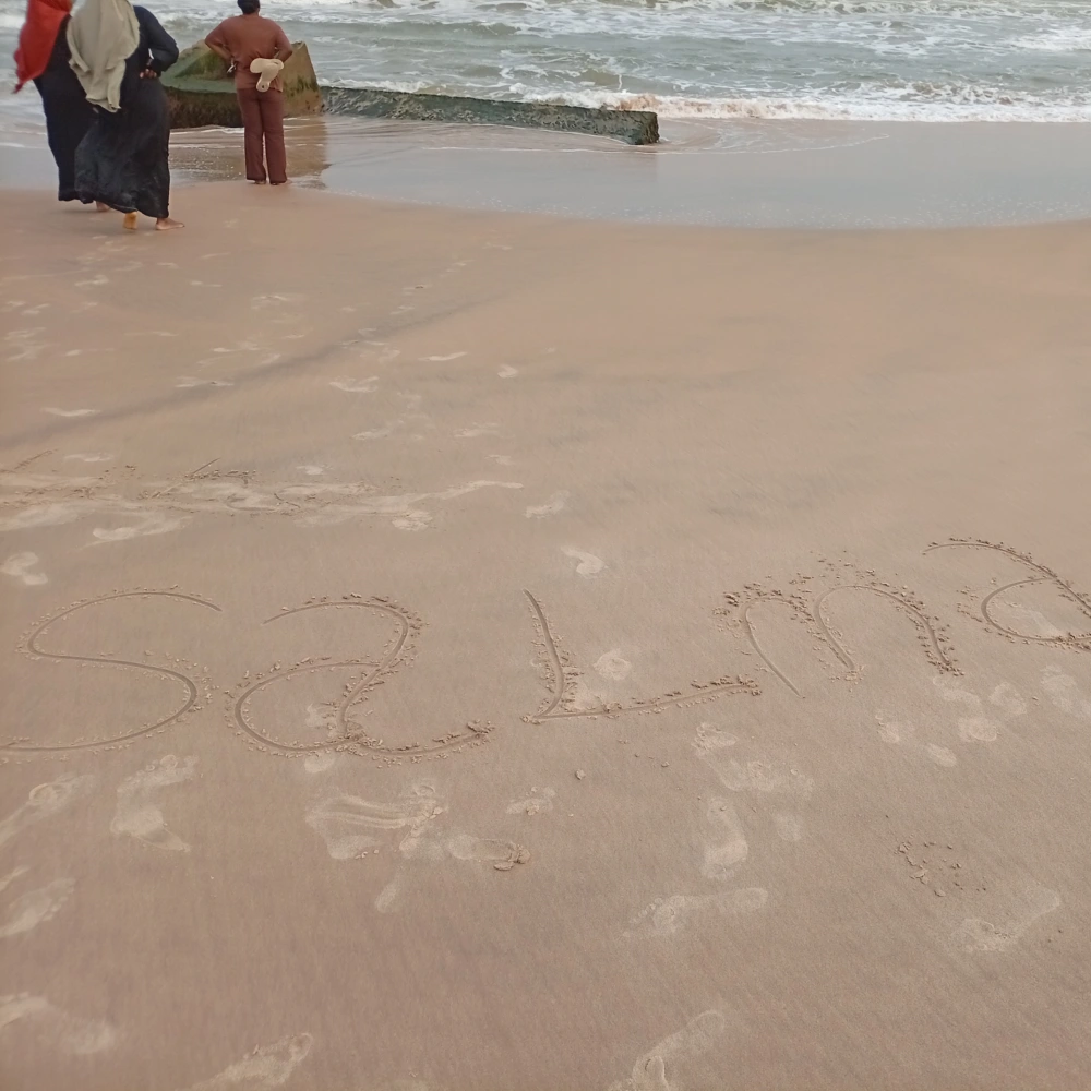 Salma name written on beach sand