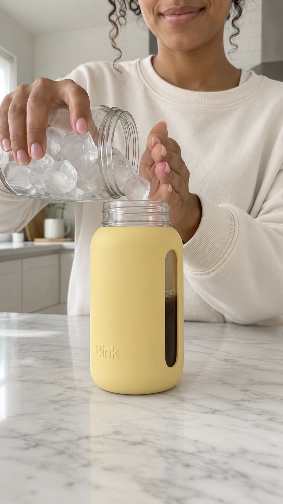 Reference image of the model holding a jar of ice cubes